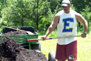 IU East athletic director Mark Hester repairs a section of the school's new cross country course.