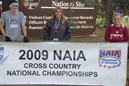 Zach Burns (left), Nicole House (right) and coach Pam Mertz at the NAIA National Championships.