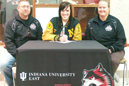Caitlin Burroughs (middle) is joined by IU East coaches Charlie Brown (left) and Londa Brown)