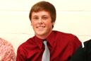 Tyler Fangman with his parents and IU East coach Mark Hester