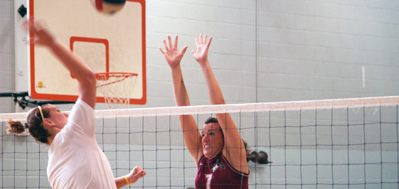 Caitlin Burroughs (right) had six kills and two blocks.