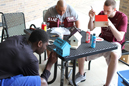 Huston Clark (left), Coach Hester and Cody Banet work on their birdhouses.