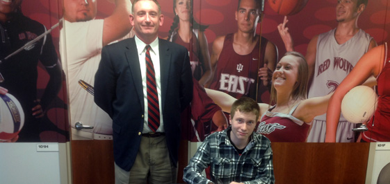 Austin Bergfield (seated) with IU East coach Brett Crowley.